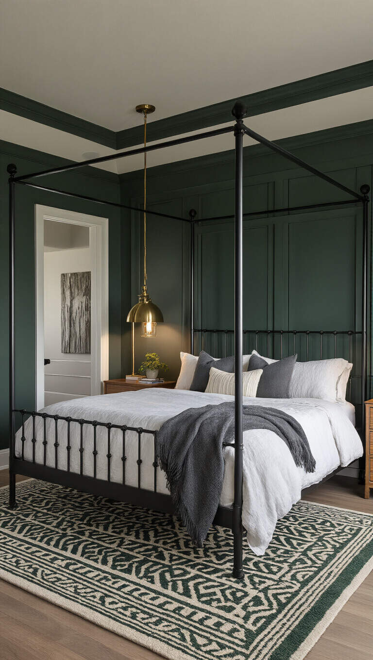 Modern 16x18ft primary bedroom at dusk featuring a black iron canopy bed with white linen and charcoal throws, green crown molding, vintage brass floor lamp, emerald and ivory geometric rug, and moody ambient lighting.
